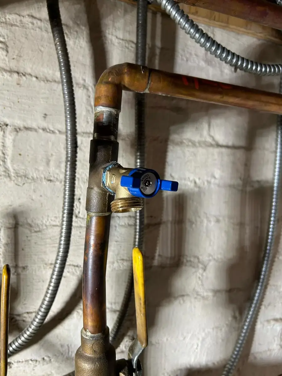 Zone piping with a blue-handled valve