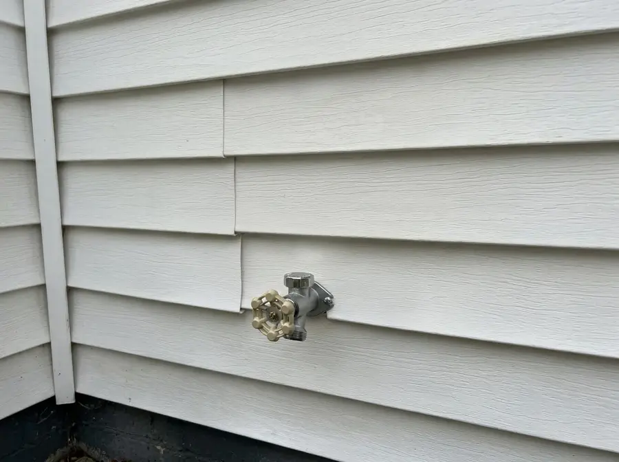 New frost-free hose bib on vinyl siding