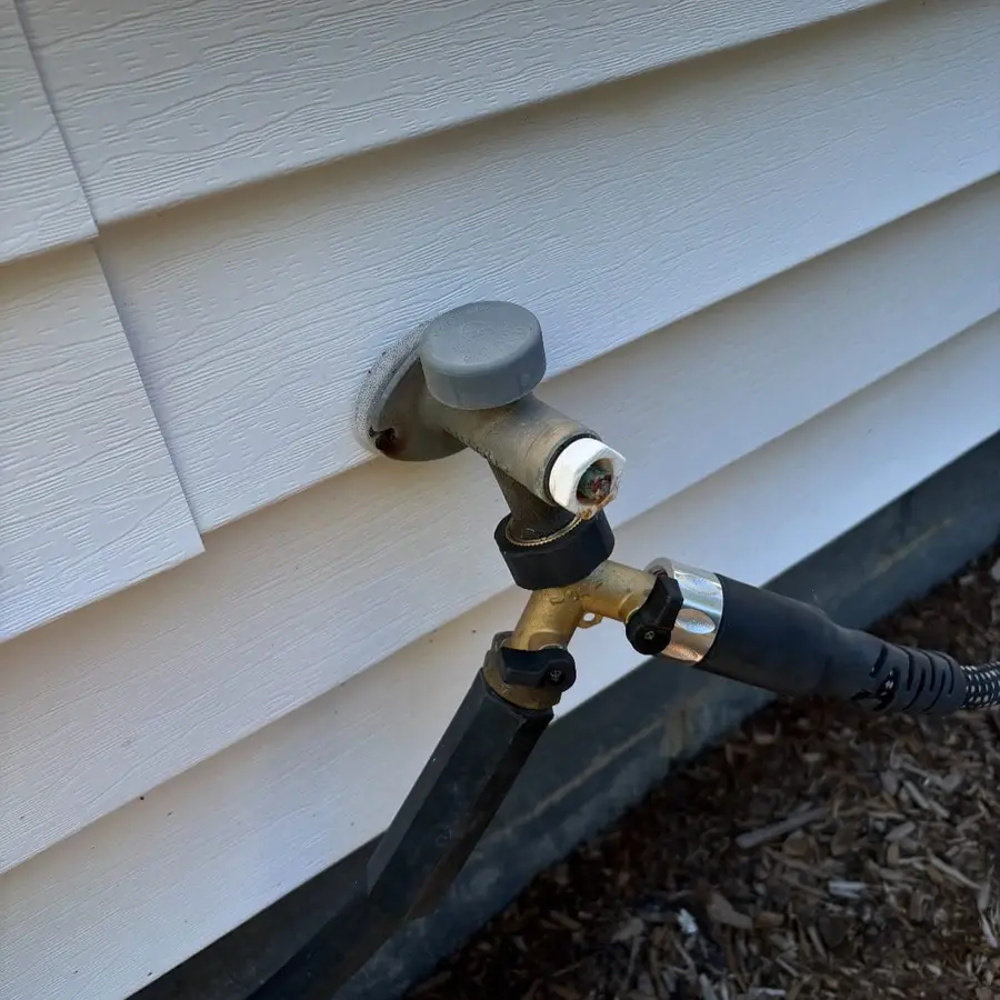 Frost-free hose bib with a hose attached