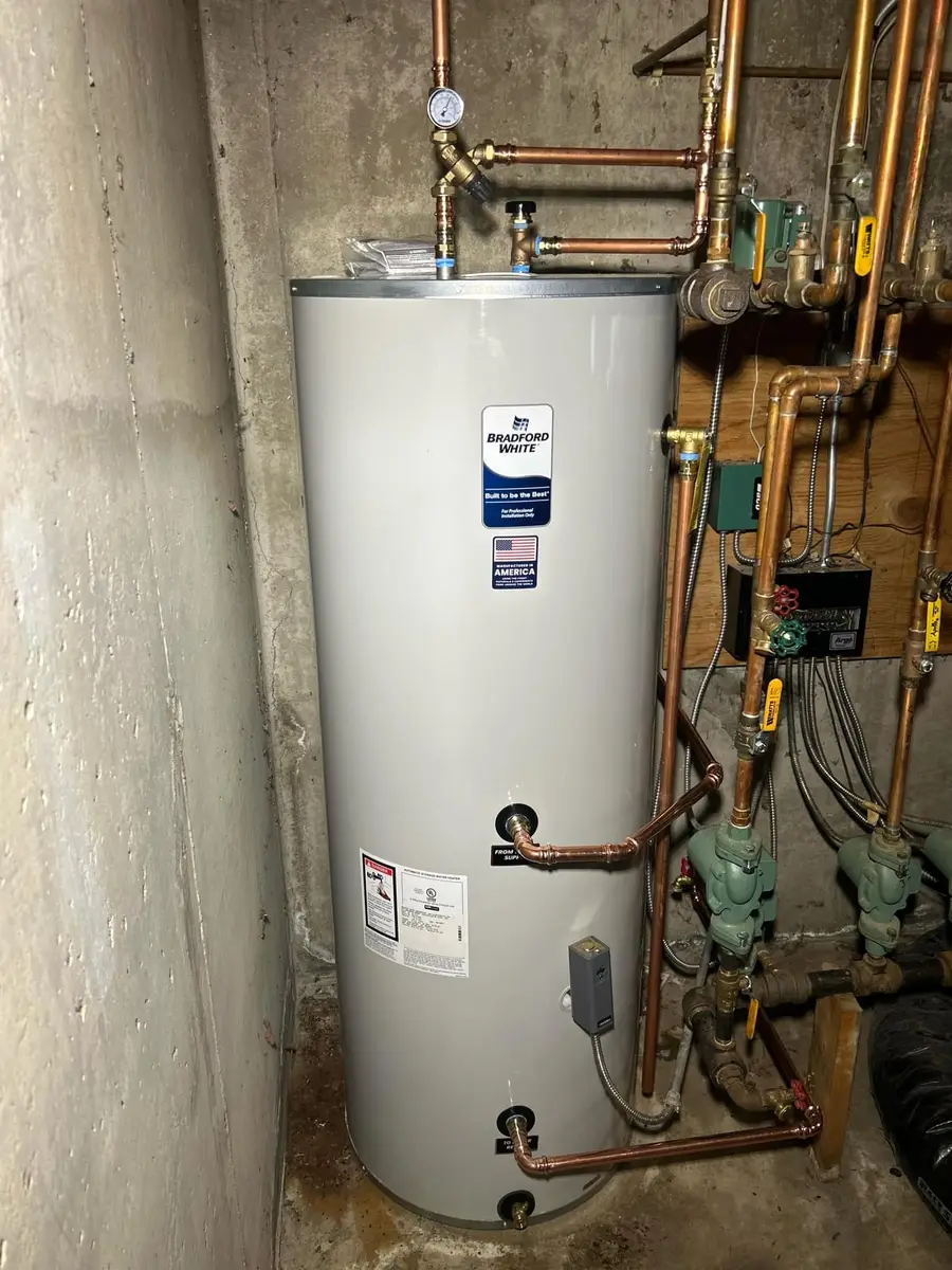 New 80-gallon indirect tank beside the boiler piping