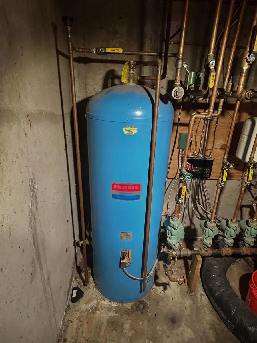 The old blue tank beside the same piping