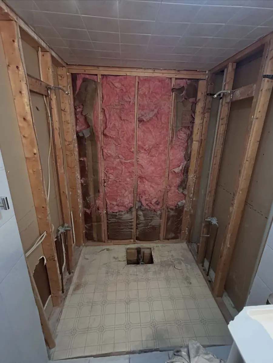 Bathroom alcove stripped back after the old tub came out