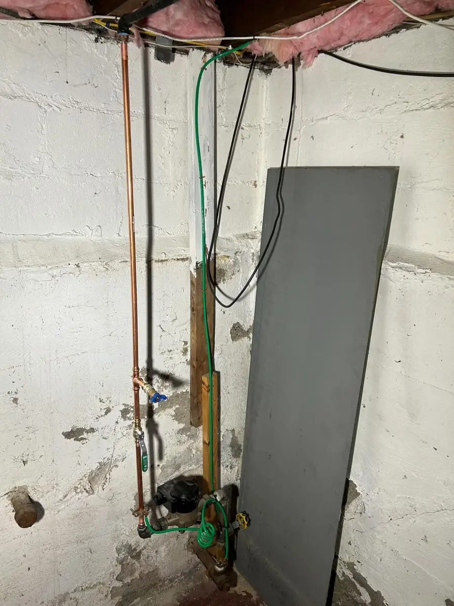 Copper water main piping at the meter in a Lynn basement