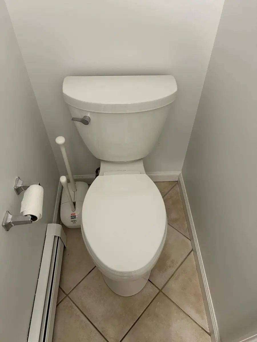 New elongated toilet in the same spot
