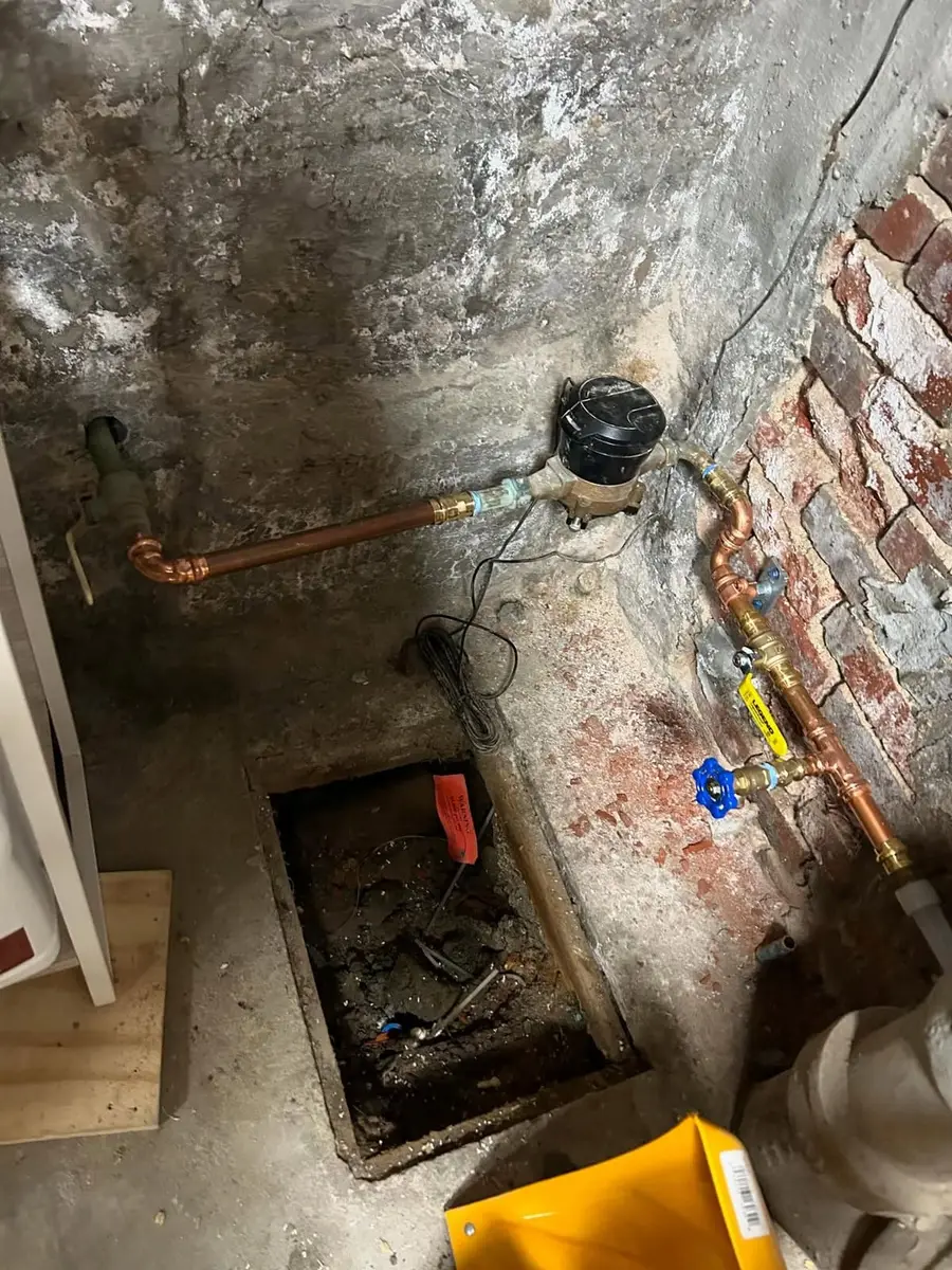 Water meter raised out of its pit with new copper