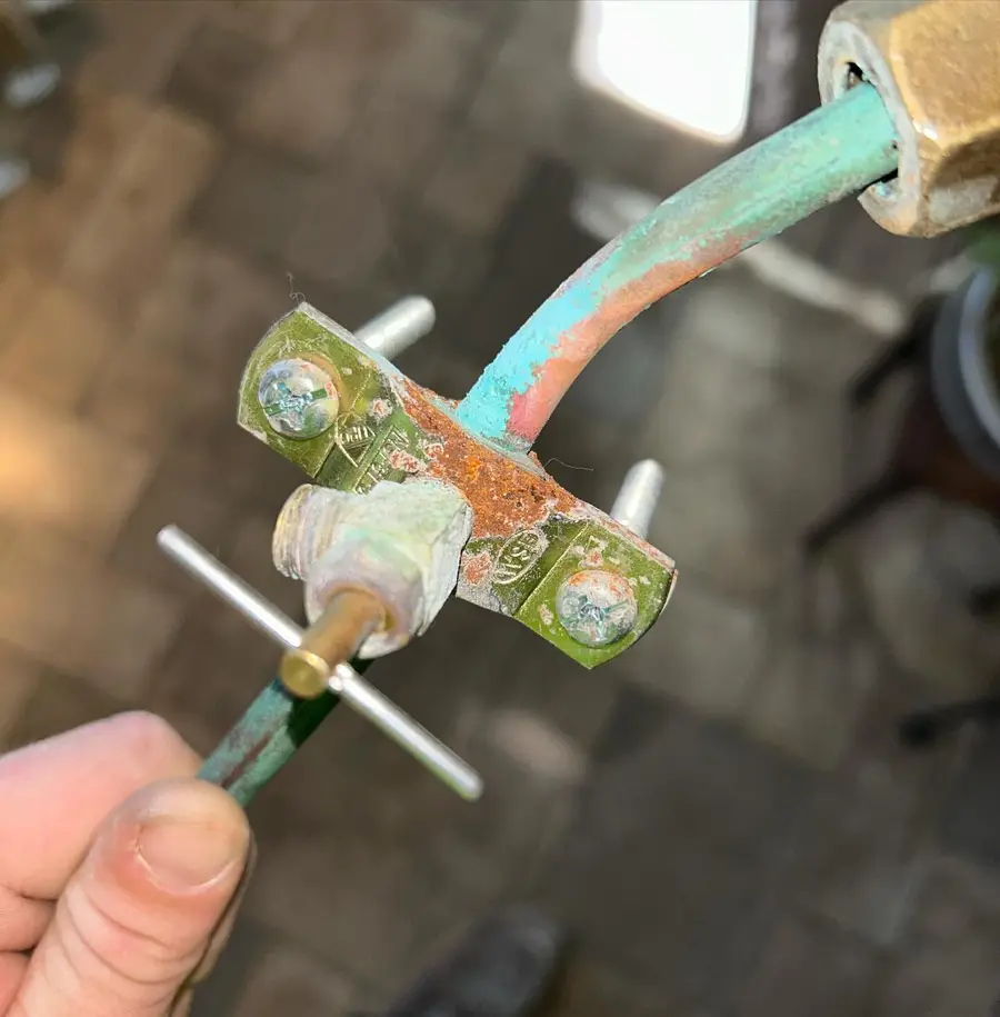Corroded saddle valve removed from a supply line