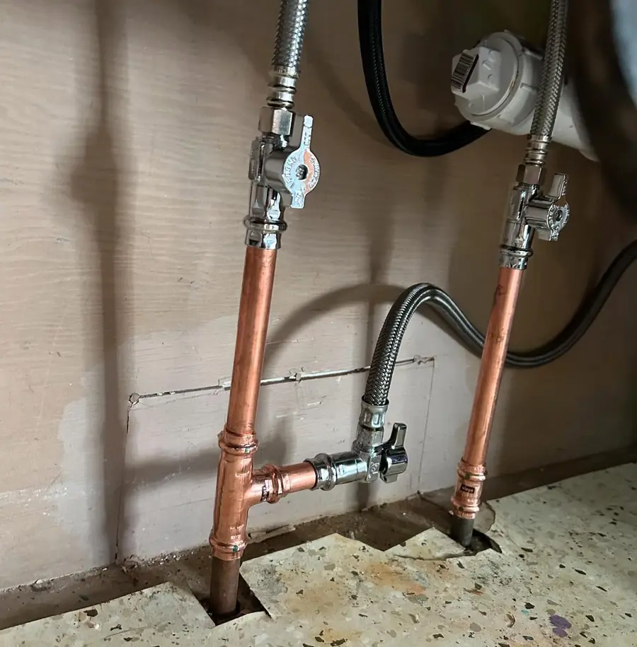 New shut-off valves on the supply lines under a sink