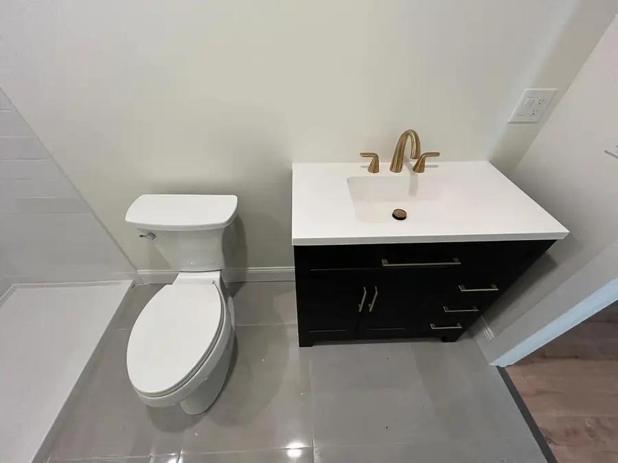 Finished bathroom with toilet and vanity, Somerville