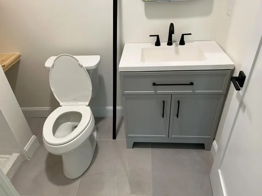 Second bathroom with a gray vanity and toilet, Somerville