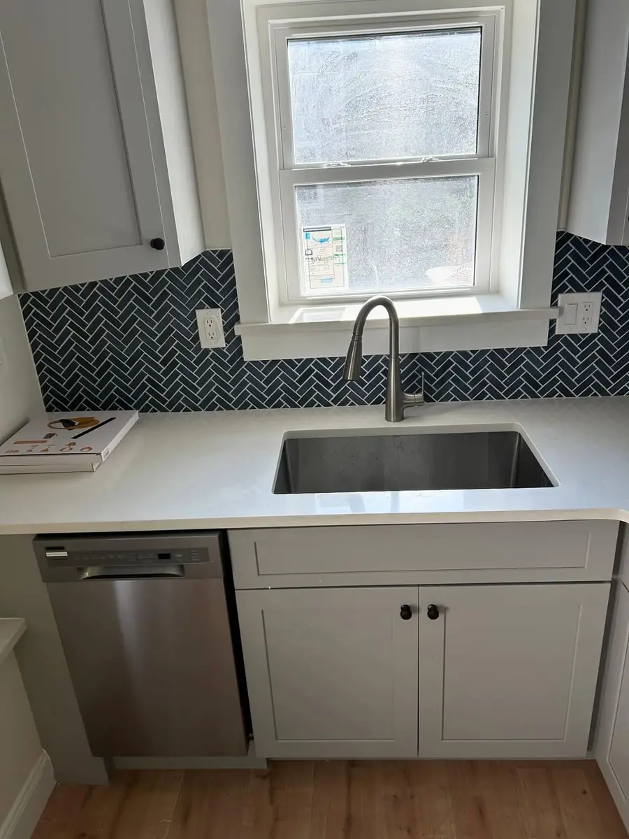 Kitchen sink and dishwasher on a finished Somerville remodel