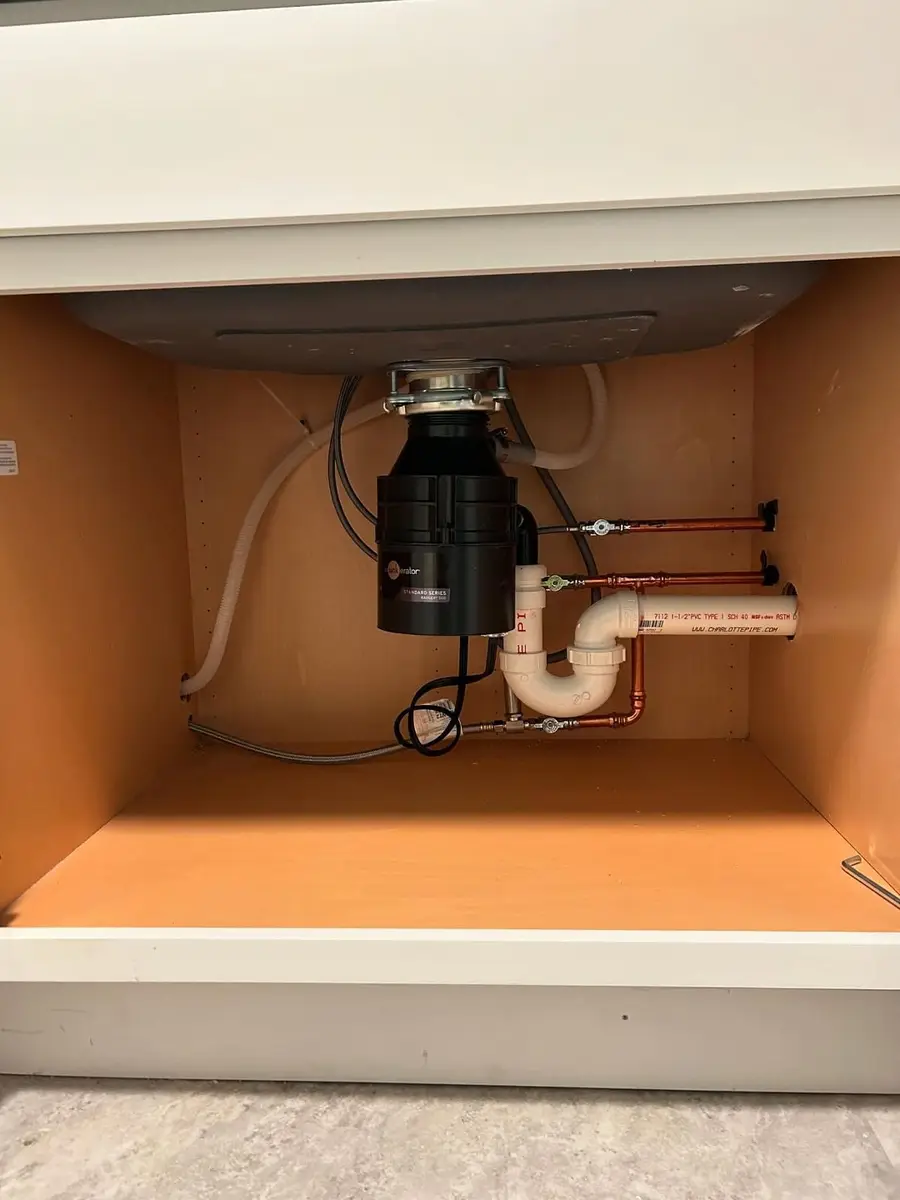 Repiped kitchen sink with garbage disposal