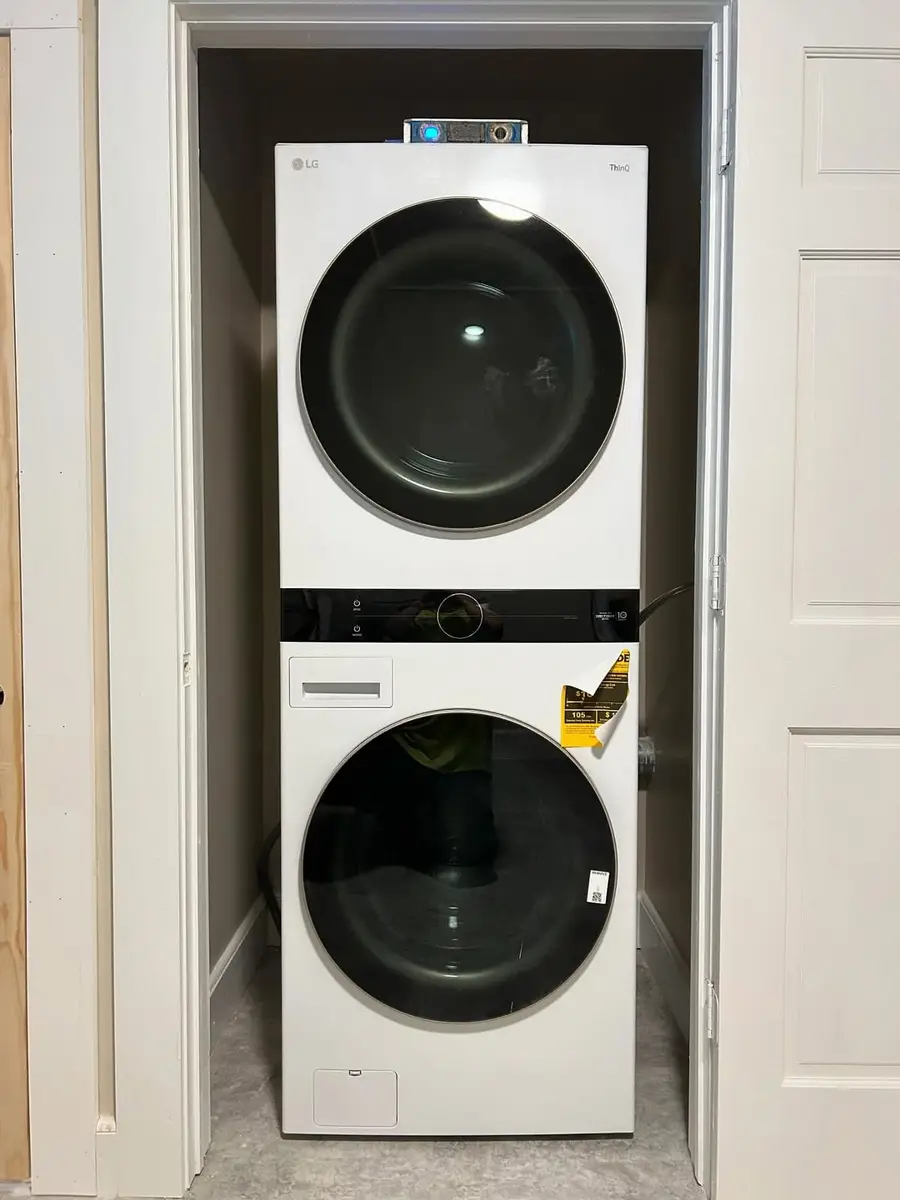 Stacked washer and dryer on the new second-floor laundry hookup