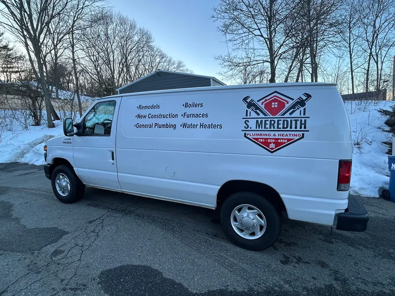 The S. Meredith Plumbing & Heating van, lettered with Shane's list of the work and his phone number